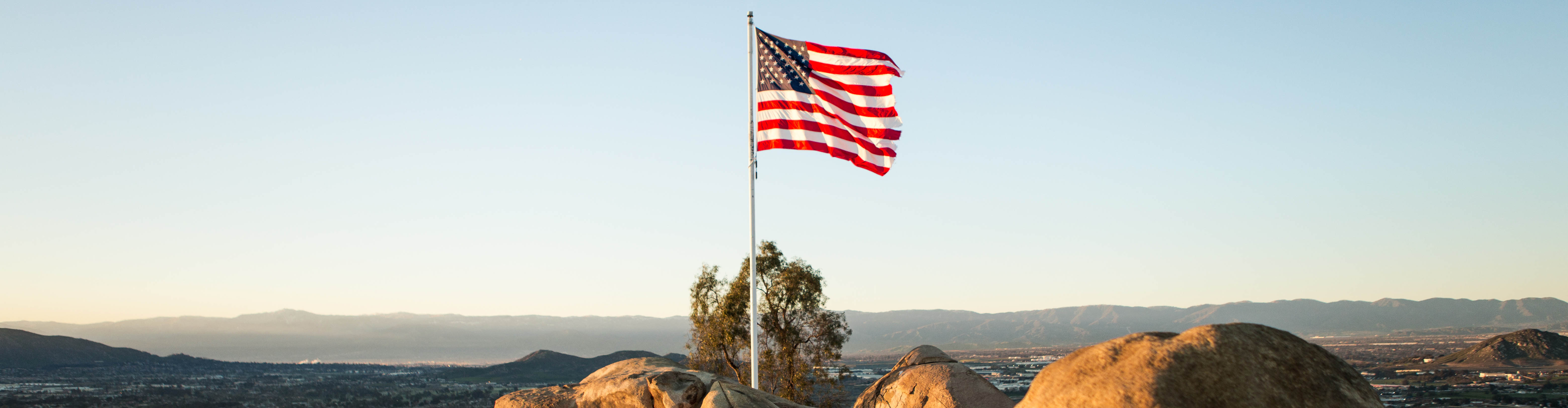 a US Flag on a hill