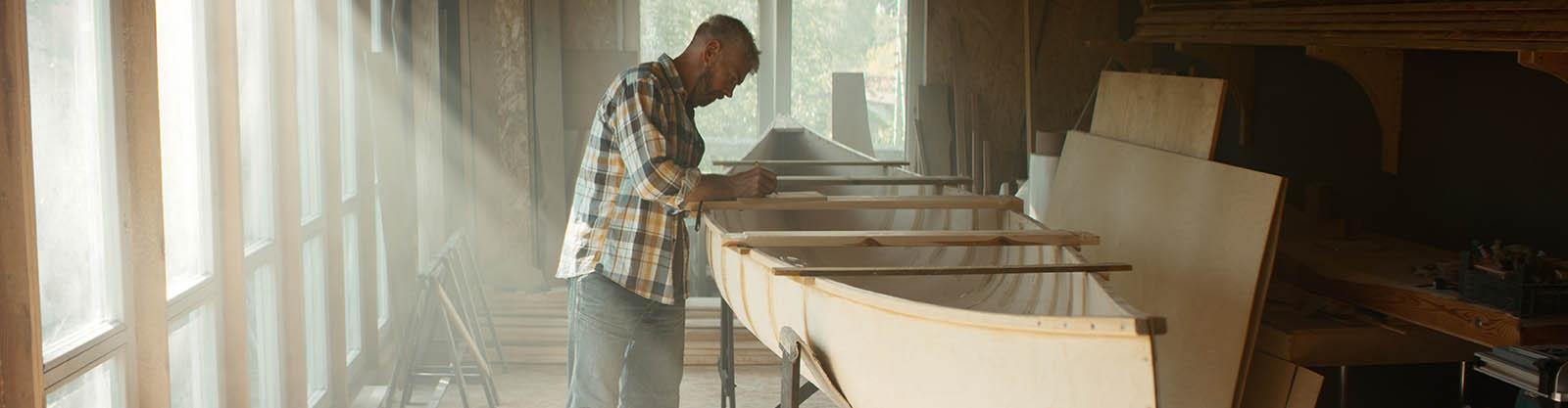 Small Business Owner building a canoe